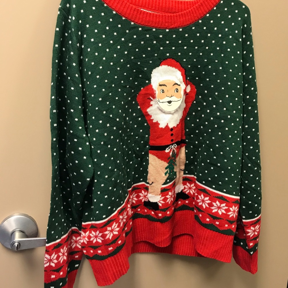 Kiss under missile toe sweater